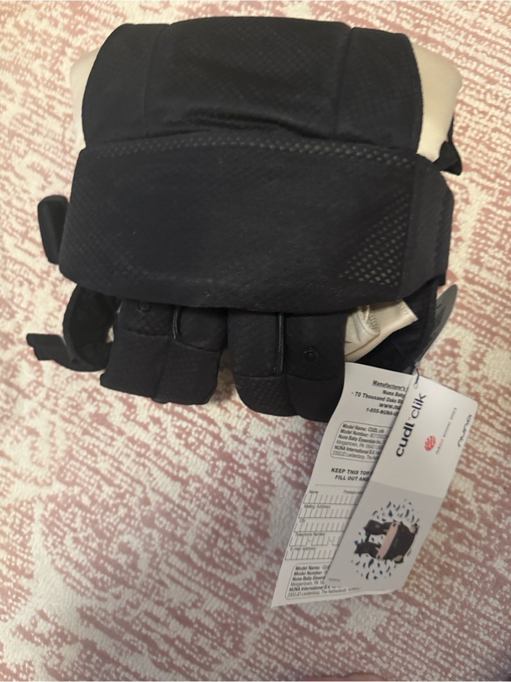 Nuna Cudl Clik carrier in Caviar (black with khaki accents)